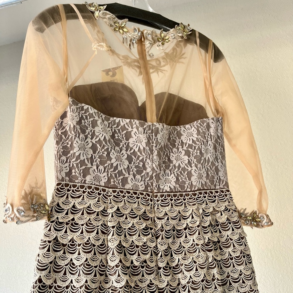 Sophisticated and elegant short formal dress with less top and 3/4 sleeves